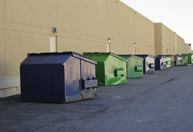 construction debris being dumped into dumpsters in Bellevue WA